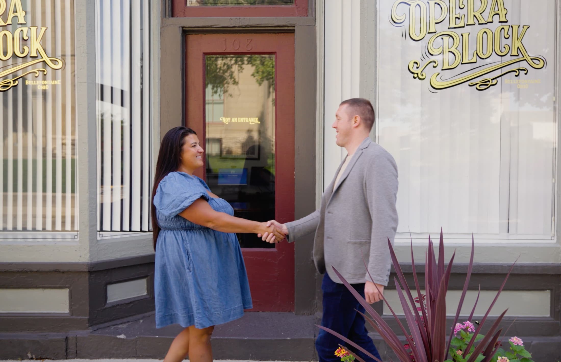 Orca co-founder Jacob shaking hands with a community bank partner